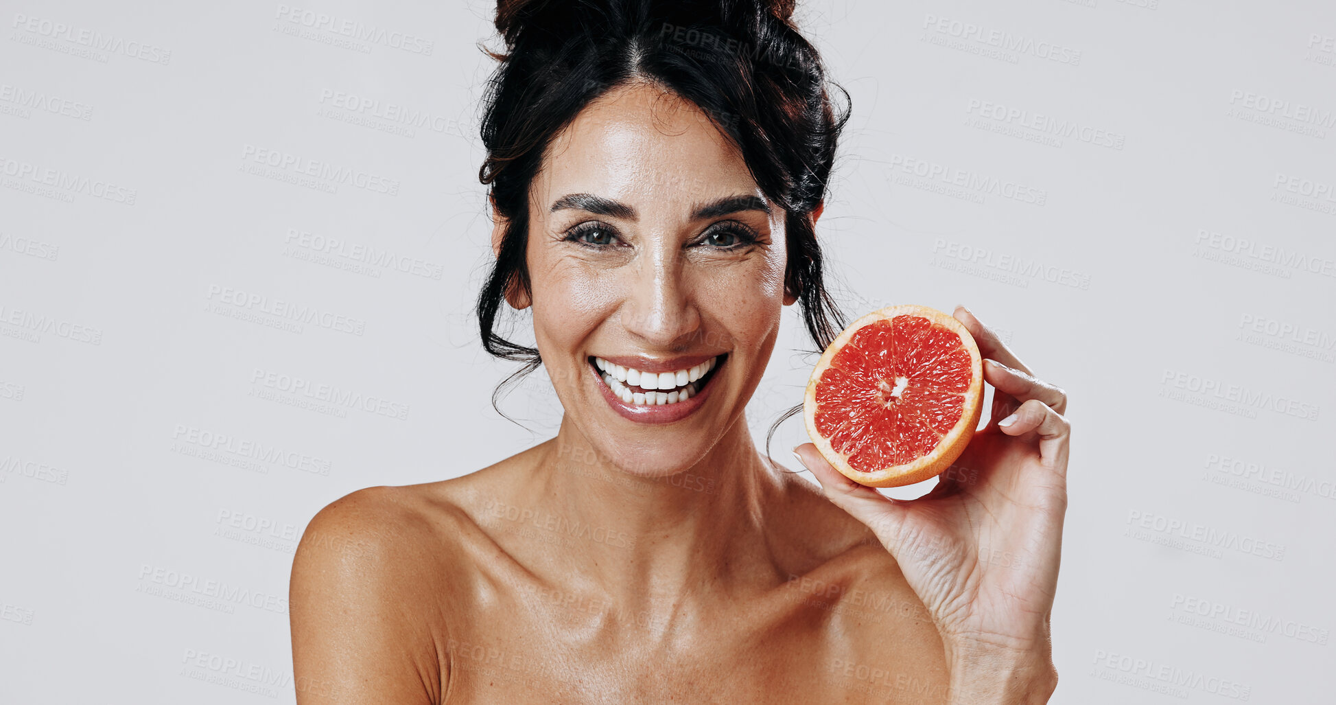 Buy stock photo Happy woman, portrait and skincare with grapefruit in studio for health on a white background. Female person, mature or smile with natural organic fruit for anti aging diet, vitamin C or antioxidants