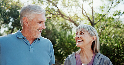 Buy stock photo Senior couple, outdoor and smile for love, funny and bonding together for relationship. Nature, woman and elderly man in garden, happiness and marriage with retirement, laughing for joke and romance