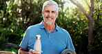 Portrait, exercise and old man in garden, yoga mat and fitness for health benefits. Outdoor, retirement and senior person in backyard, morning routine and water bottle for nutrition, nature and smile