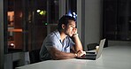 Bored, laptop and night with business man in office for planning fatigue or research deadline. Computer, reading and tired with exhausted employee at desk in dark workplace for overtime burnout