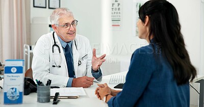 Buy stock photo Happy, consultation and doctor with woman in hospital with medical diagnosis in office with feedback. Smile, checkup and mature healthcare worker with female patient for planning treatment in clinic.