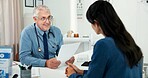 Paperwork, consultation and doctor with woman in hospital with medical diagnosis in office. Documents, checkup and mature healthcare worker with female patient for planning treatment in clinic.