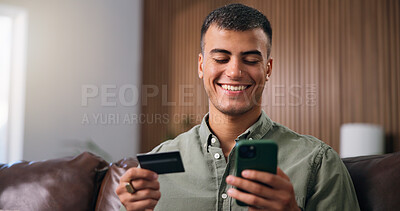 Buy stock photo Credit card, smartphone and man on sofa in home with online shopping, ecommerce or purchase on website. Technology, debit and male person with phone for paying bills with internet banking in house.