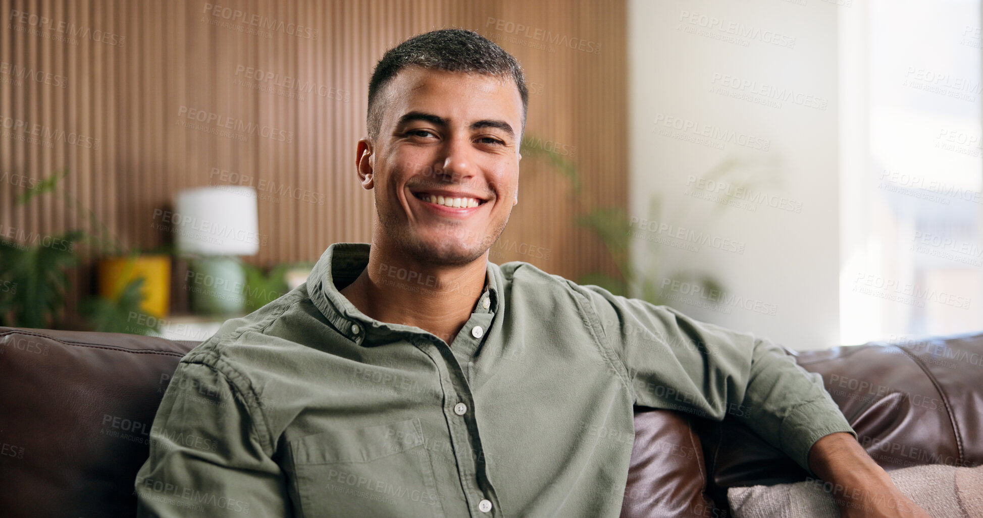Buy stock photo Happy, portrait and man on couch in home for weekend, rest and afternoon break. Smile, wellness and male person relax on sofa with confidence, positive attitude and pride in house living room