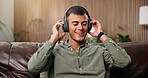 Man, smile and relax with headphones on sofa for streaming, song and sound in living room at house. Person, eyes closed and listen to music with subscription, audio or happy for album at apartment