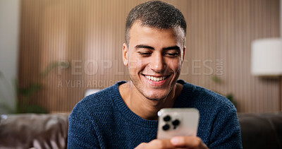 Buy stock photo Relax, happy and man in home with phone for social media, online dating and chat on weekend. Smile, house and person on smartphone for internet, connection and reading notification on mobile app