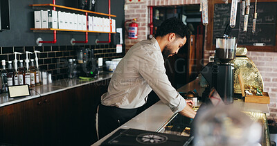 Buy stock photo Barista, business owner and countertop with man in coffee shop for management of startup. Cleaning, hospitality and surface with entrepreneur person in cafe or restaurant for professional service