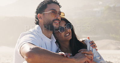 Buy stock photo Vacation, hug and smile with couple on beach for travel, summer and holiday together. Sunglasses, man and woman with date for love, bonding and view for weekend break and relax for honeymoon trip