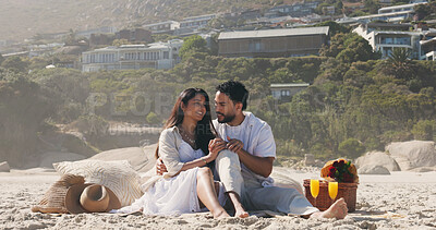 Buy stock photo Couple, holding hands and picnic with love at beach for romantic date, celebration and bonding together. Smile, people and embrace with flowers for romance, anniversary getaway and holiday at seaside