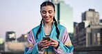 Woman, fitness and phone with earphones in city for break, streaming service or smile for audio. Gen z girl, runner and listen to music on app, happy and rest with smartphone for exercise in town