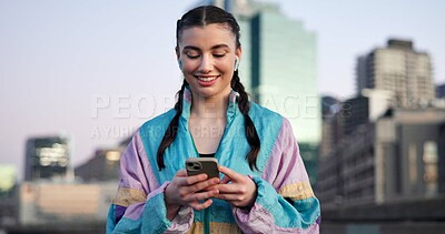 Buy stock photo Woman, fitness and phone with earphones in city for break, streaming service or smile for audio. Gen z girl, runner and listen to music on app, happy and town with smartphone for exercise in evening