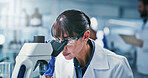Science, goggles or woman in laboratory with microscope, test or examination in biochemistry. Clinical research, glasses or scientist with equipment, medical analysis or inspection in rna development