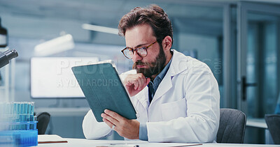 Buy stock photo Scientist, reading or man with tablet in lab, online research paper or pathology trial study for info. Experiment results, review or researcher with vaccine development news, medical journal or tech