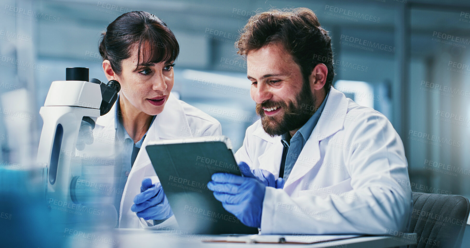 Buy stock photo Tablet, research and people in lab, talking and collaboration for experiment results. Science, man and woman in meeting, teamwork and happy for biotech breakthrough and investigation for medical cure