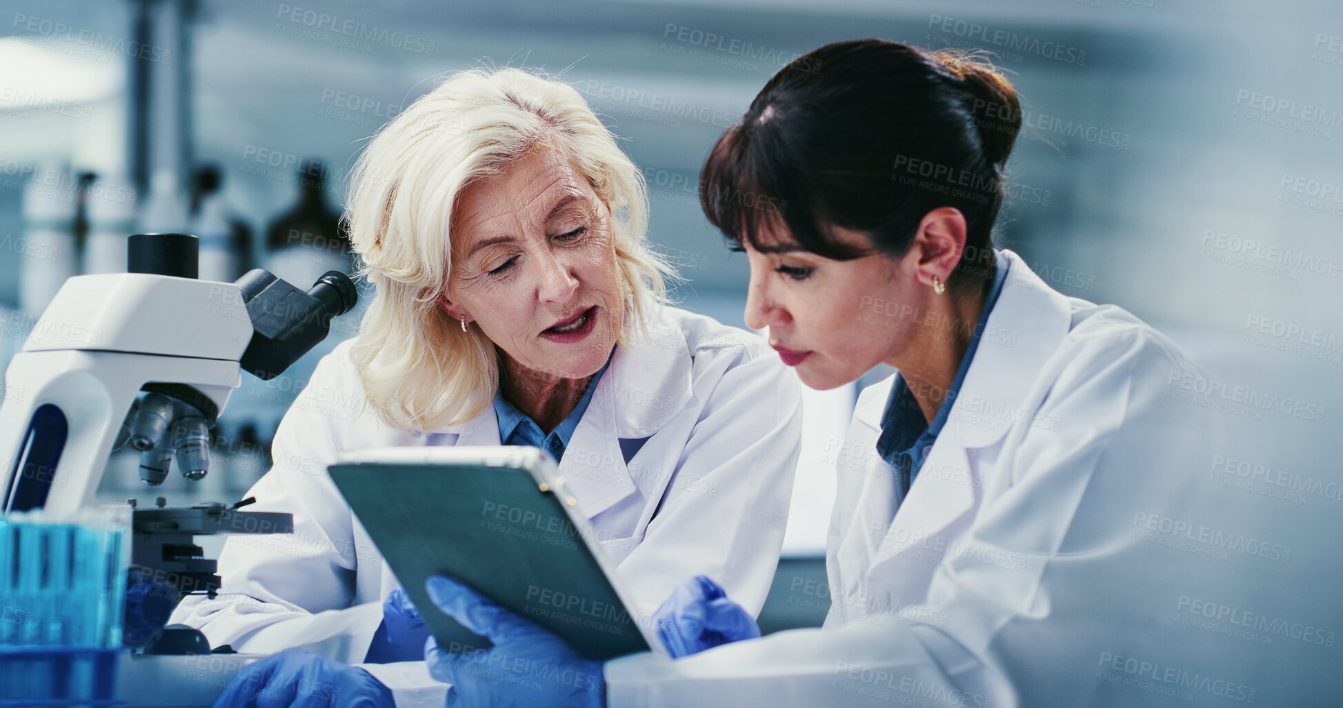 Buy stock photo Tablet, research and women in lab, discussion for experiment results and coaching. Science, mentor and people in meeting, teamwork and email for medical report and collaboration for biotech project