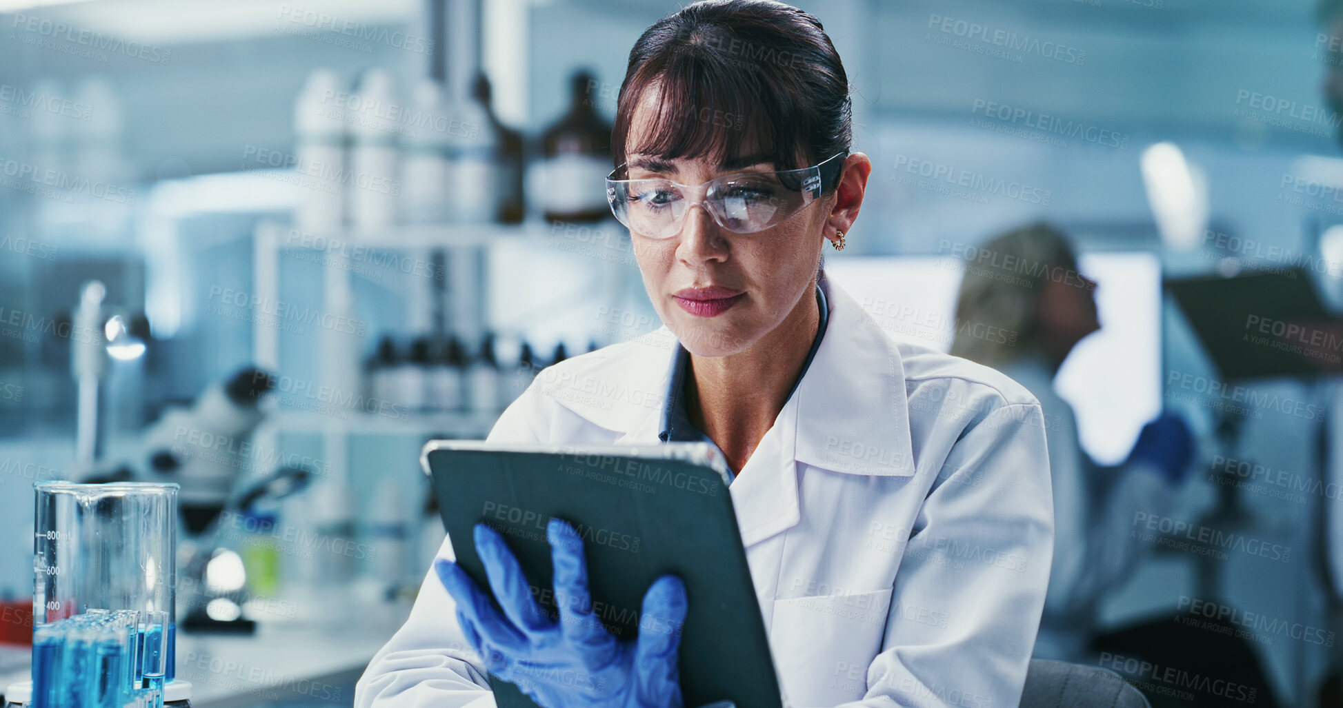 Buy stock photo Woman, scientist and tablet with review at lab for notes, medical research and ppe glasses for virus cure. Person, tech and checklist on app for progress report, feedback or pharma study for vaccine