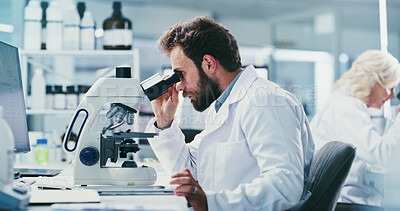 Buy stock photo Man, scientist and microscope with study at lab for sample, medical research and bacteria for virus cure. Person, gear and assessment with equipment, pharma career or project for vaccine development