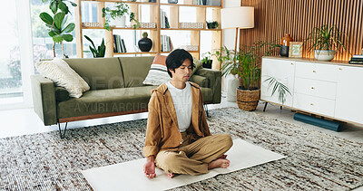 Buy stock photo Zen, man and meditation with balance in lounge, mindfulness or calm with spiritual awareness in home. Person, mudra and self care for mental health on break, stress relief and inner peace with yoga