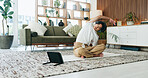 Stretching, tablet and yoga with Asian man in home living room for exercise or wellness routine. App, fitness and headphones with yogi person on floor in apartment for online class or tutorial
