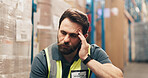 Tired, headache and man in warehouse for shipping, supply chain and delivery backlog. Frustrated, burnout and person with stress for logistics fail, distribution mistake and fatigue in storage depot