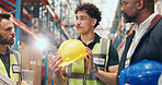 Logistics, meeting and man in warehouse with helmet for safety, stock control and PPE. Protection, distribution and team with supervisor for storage, shipping and inspection for order with flare