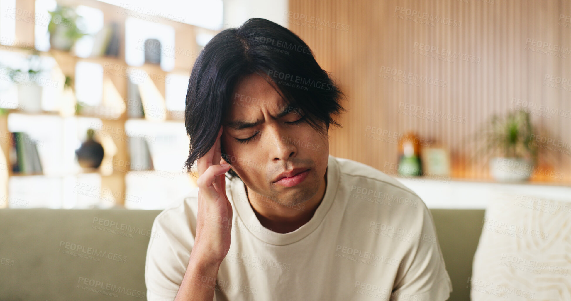 Buy stock photo Sick, man and headache in home with fatigue, unemployment crisis and symptoms of medical problem. Tired, person and migraine in living room with health issue, pain and burnout from jobless stress.