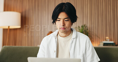 Buy stock photo Man, reading and remote work in home with laptop, digital marketing website or plan for campaign. Freelancer, person and research on sofa with computer, creativity or online branding for advertising.