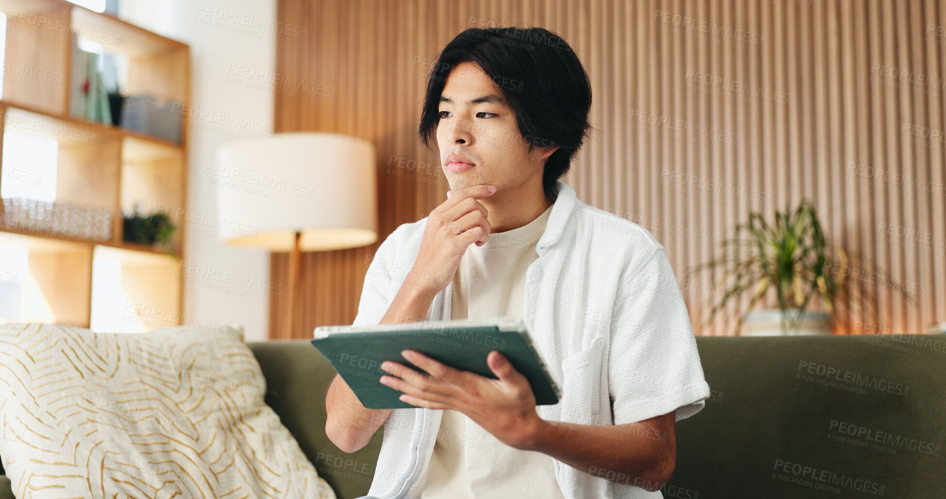 Buy stock photo Man, thinking and remote work in home with tablet, digital marketing idea or inspiration for project. Freelancer, person and reflection on sofa with tech, creativity or vision for online advertising.