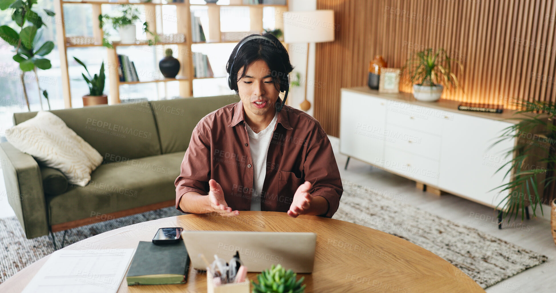 Buy stock photo Man, consultant or remote work with headset for video call, customer service or online advice. Male person, asian agent or freelancer talking on computer for virtual chat, webinar or meeting in home