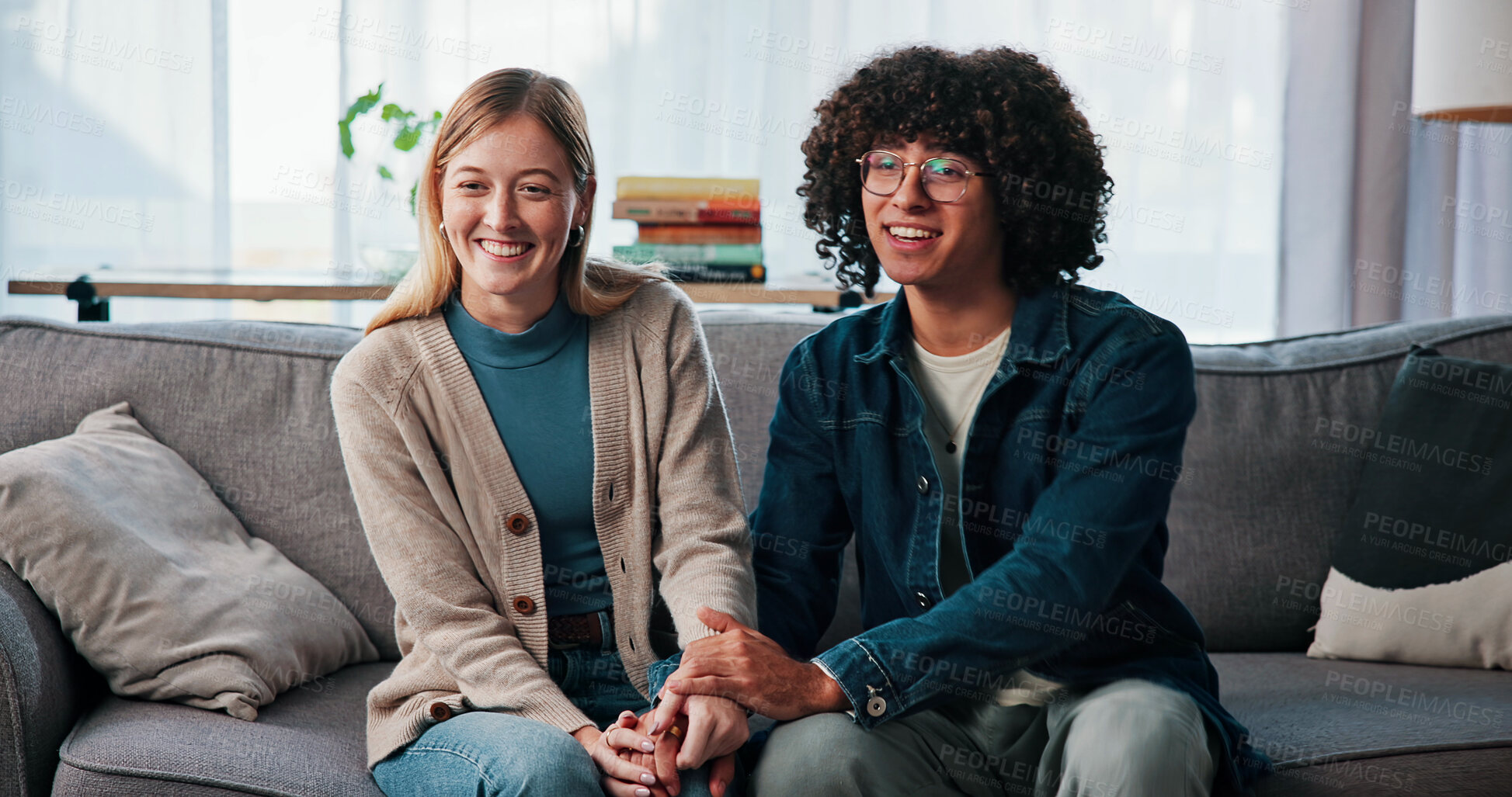 Buy stock photo Psychology, happy couple and holding hands in consultation for love, support or reconciliation. Man, woman or counseling for advice in therapy, save marriage or help with interracial people in office
