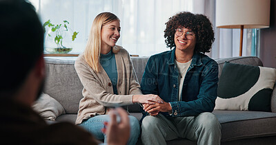 Buy stock photo Psychologist, happy couple and holding hands in consultation for love, support or reconciliation. Man, woman and counseling with therapist for advice, save marriage or help in office with solution
