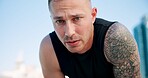 Runner, breathe and portrait of man in city for break from exercise, workout or training with fatigue. Sports, tired and person in town for rest, calm and fitness for active hobby, wellness or health