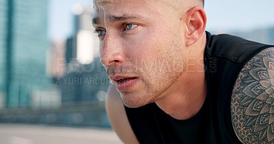 Buy stock photo Runner, tired and man in city breathe from exercise, workout and training with fatigue. Sports, athlete and person in town for rest, challenge and fitness for active hobby, wellness and health