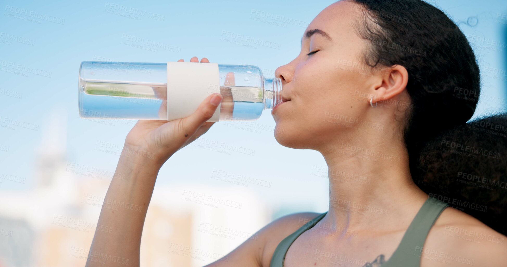 Buy stock photo Woman, fitness and drinking with water for hydration, outdoor sustainability or thirst. Active, female person or runner with mineral liquid or beverage for break, rest or recovery in an urban town