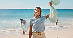 Portrait, beach and woman with trash bag, volunteer for social responsibility and excited to recycle. Ocean, cleaning environment or person with plastic collection, sustainability or waste management
