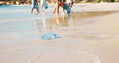 Buy stock photo Beach, bottle and recycling litter on sand, trash and volunteer with plastic bag for sustainability. Ocean, pollution and people with social responsibility in nature, outdoor and cleaning garbage