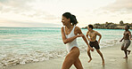 Running, friends and woman on beach for holiday, travel adventure and tropical destination for getaway. Ocean, sunset and group of people with happiness for island vacation, bonding and fun in Bali
