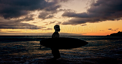 Buy stock photo Silhouette, surfboard and walking with person on beach for holiday, sports hobby or weekend getaway. Activity, sunset and vacation with surfer outdoor at coast for fitness or training in summer