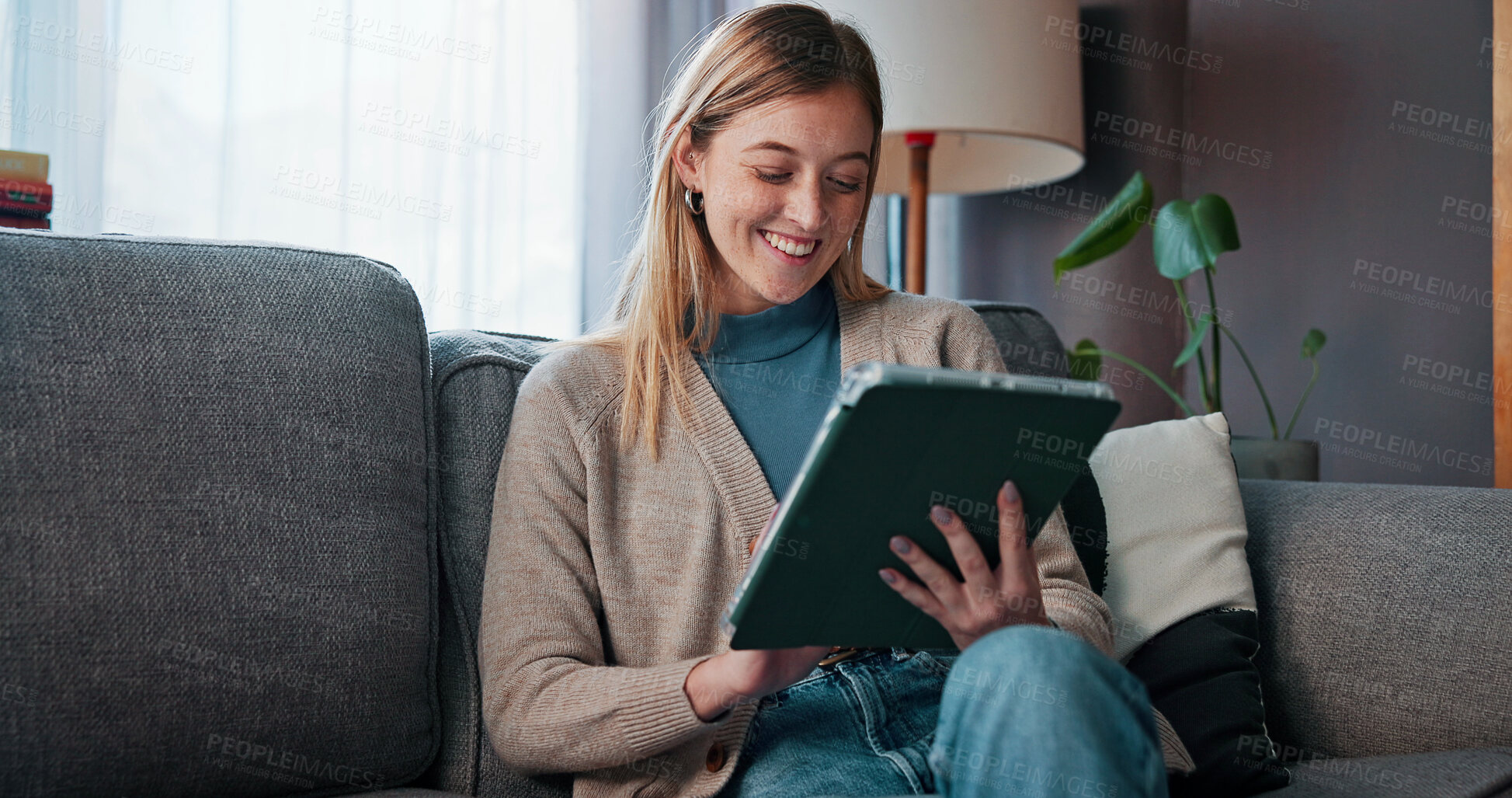 Buy stock photo Smile, reading and woman with tablet on couch, digital news article and social media break on weekend. Ebook app, browsing internet and person with tech in home, check email and subscription service