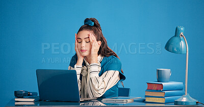 Buy stock photo Studio, writer or woman with headache, stress and vintage with laptop on blue background. Migraine, pain and tired business person with mental fatigue for brain fog, burnout or retro with computer