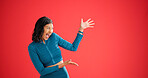 Fitness, excited and woman with pointing in studio, sports club discount and sign up for training. Promotion, membership sale and coach with mockup space for announcement, smile and red background