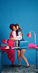 Happy, hug and business women in office with space for teamwork, bonding or friendship together. Smile, laptop and female creative editors embracing for celebration on article publishing at startup.