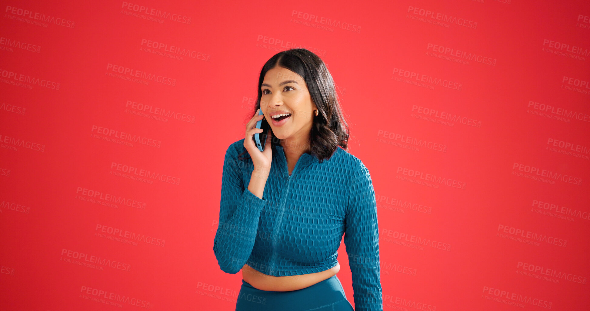 Buy stock photo Woman, surprise and phone call for fitness in studio with contact, happy or mockup space on red background. Girl, smile and wow with smartphone, funny story and chat for gossip on break for exercise