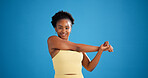 Portrait, stretching or black woman in studio for fitness, warm up routine or arm muscle relief activity. Start training, happy athlete or workout preparation for wellness, space or blue background