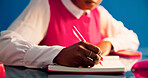 Student writing, learn and hands with notebook on desk, education and preparation for exam with info. University, knowledge and person with journal for ideas, study and planning for test with notes