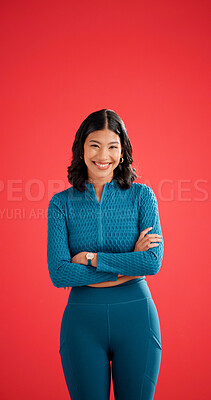 Buy stock photo Happy, athlete and woman with arms crossed in studio, portrait or confident for fitness with workout. Red background, wellness and healthy person with smile on space, strong and body care in Colombia