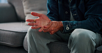 Buy stock photo Hands, anxiety and man on sofa at clinic for psychologist with emotional support or advice on mental health. Nervous, stress and male person with life coach for therapy, help or counseling session.