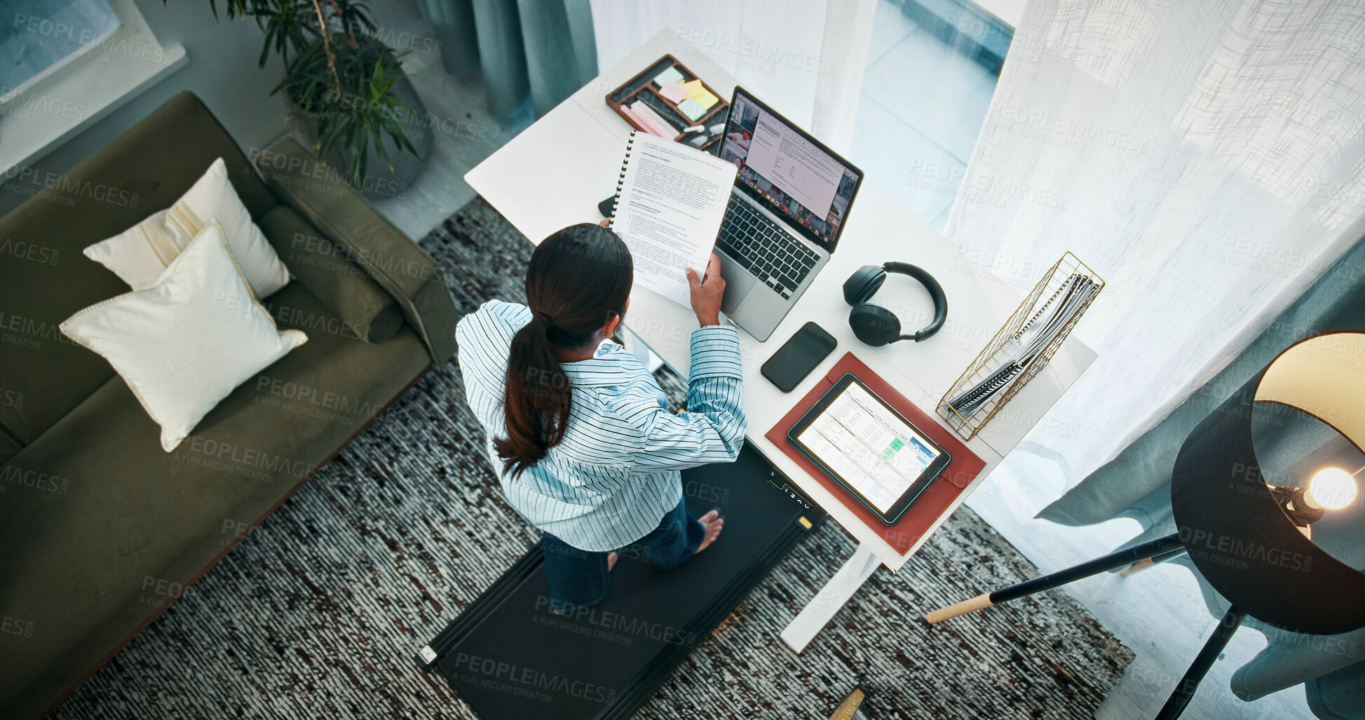 Buy stock photo Woman, treadmill or documents with laptop on standing desk above for finance in home. Top view, female person or freelancer with computer, paperwork or tablet on walking pad for remote work in house