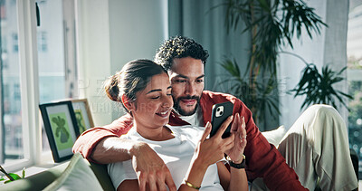 Buy stock photo Phone, relax and couple on sofa for social media, online networking and bonding on weekend. Marriage, happy and man with woman on smartphone for internet, browse website and connection in home