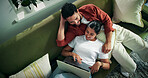 Happy, couple and relax with laptop on couch, conversation or planning for trip with discount offer. Above, man and woman with tech for ticket purchase, booking and people with flight info in house